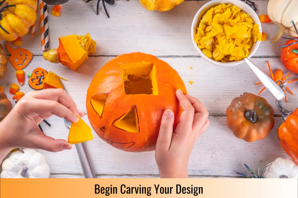 removing a carved out piece of pumpkin to make an eye for the jack o lantern