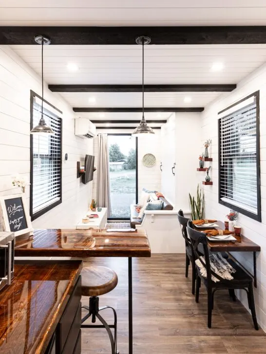 this tiny home uses bright white walls and lots of light as ways to expand a tiny home