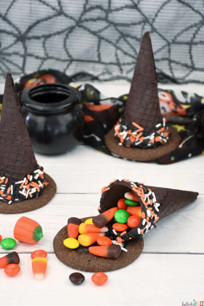 Close up of candy inside ice cream cone witch hat. 