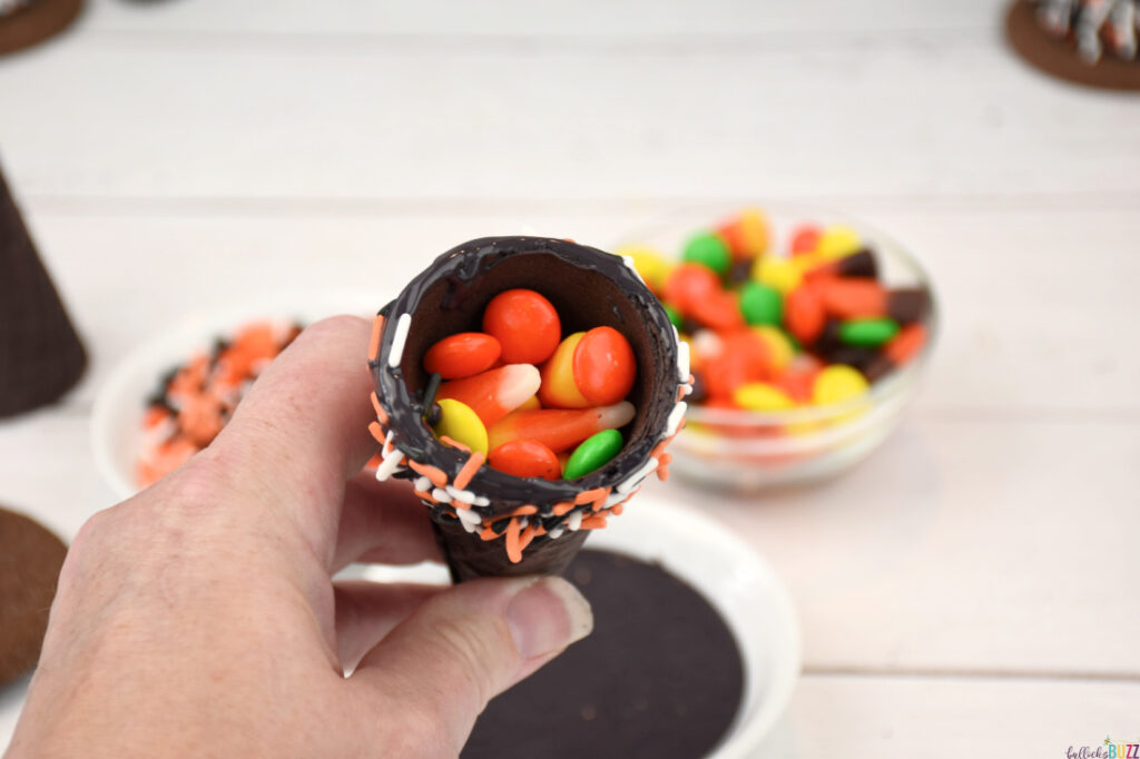 Fill the cone with candy.