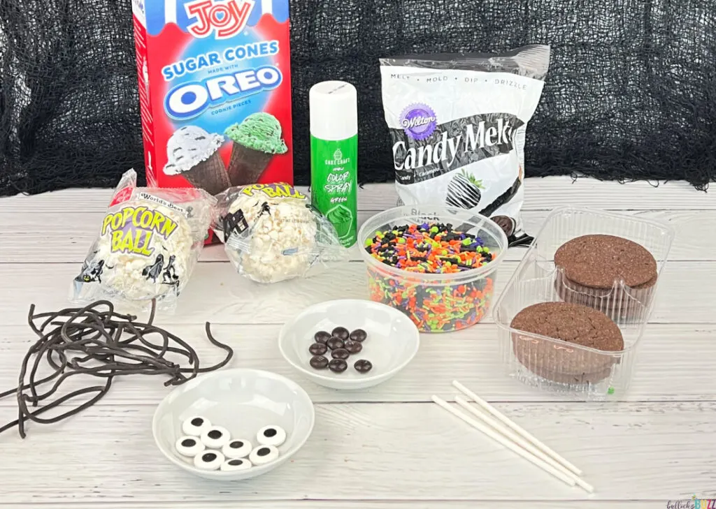 ingredients to make Halloween Popcorn Ball Witches laid out on a table
