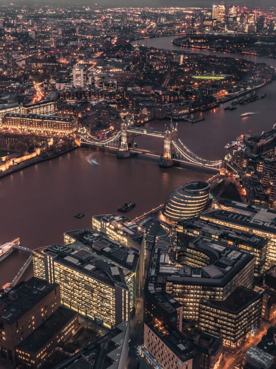 An overhead view of the city of London at night - a must when planning your vacation to London.