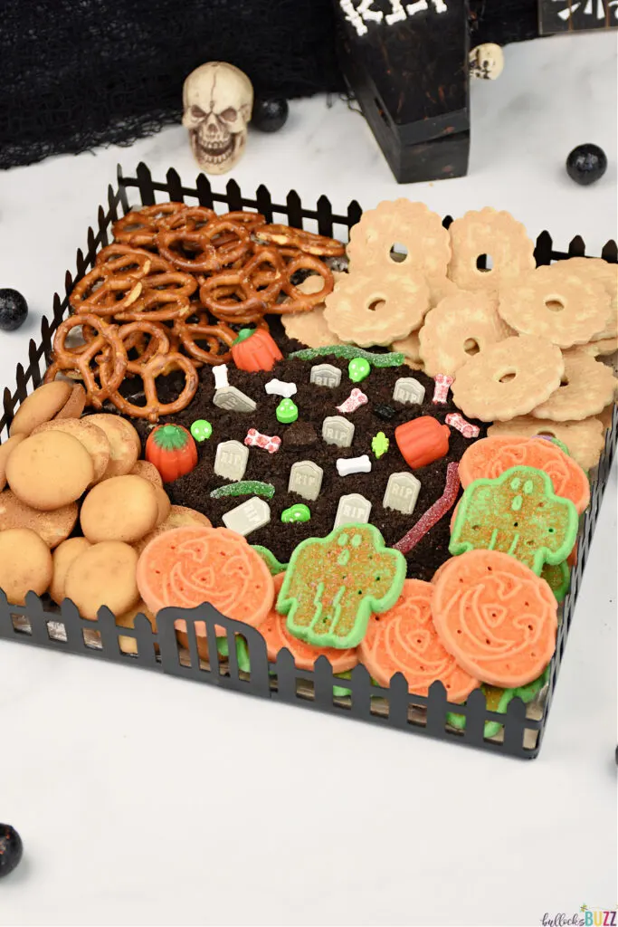 An easy Halloween dessert frosting board made to look like a graveyard