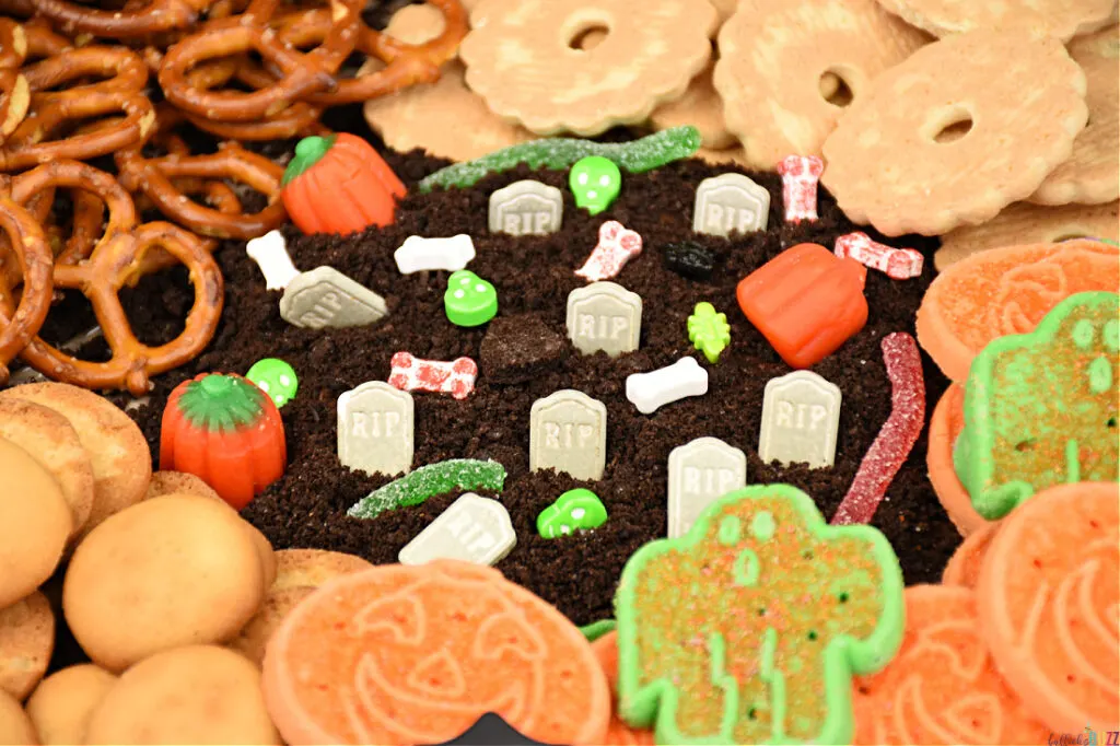 A close up of the frosting graveyard in the middle of Halloween Frosting Board.