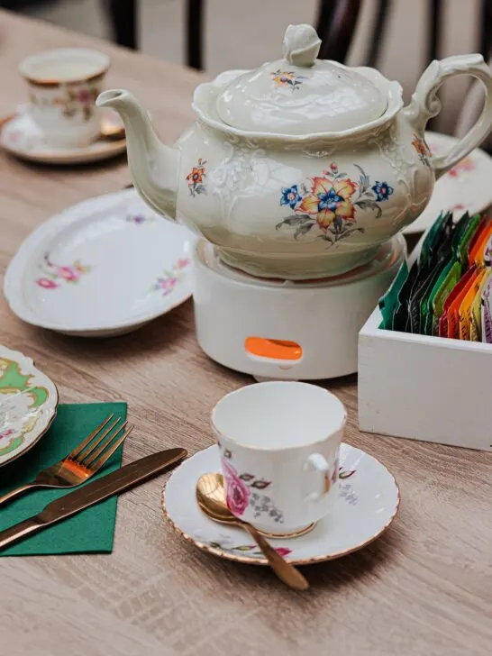 A table set up for high tea using fine china which highlights some of the differences between afternoon tea and high tea.