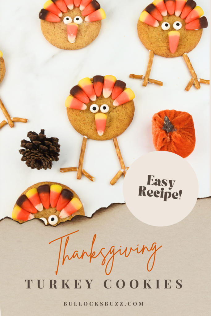 Several Thanksgiving Turkey Cookies with candy eyes, candy corn feathers and beak, and pretzel legs,