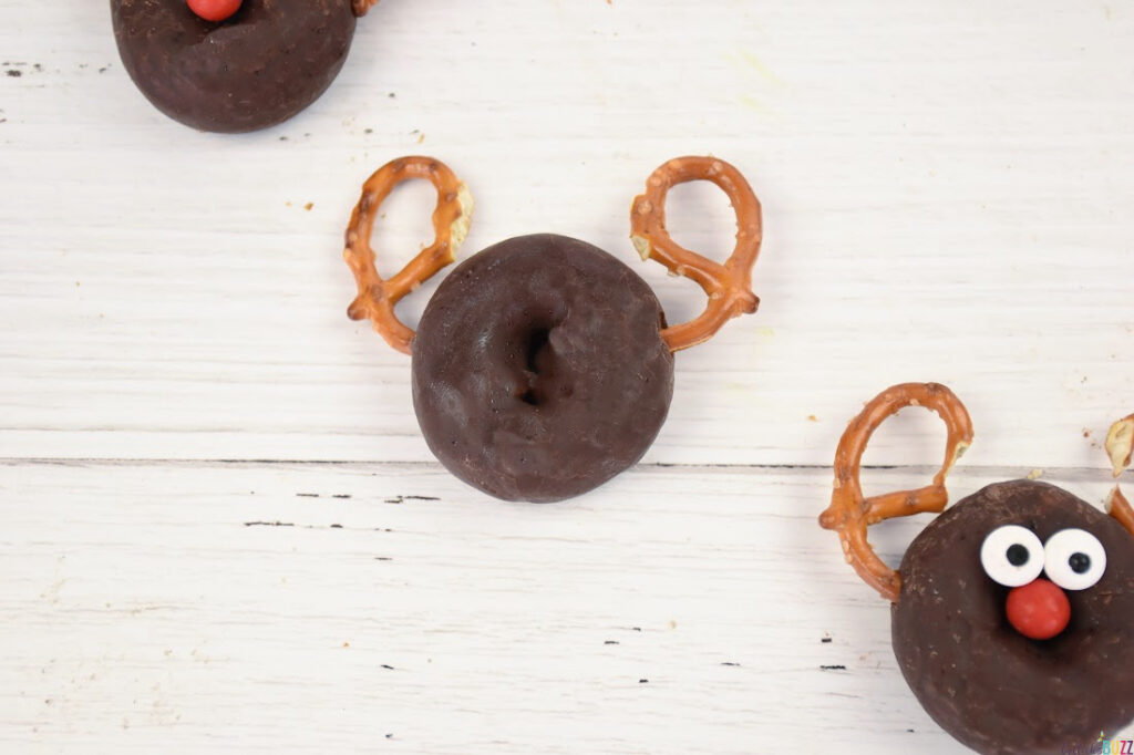 Add pretzel halves on each side of Mini chocolate donut to make the reindeer's antlers