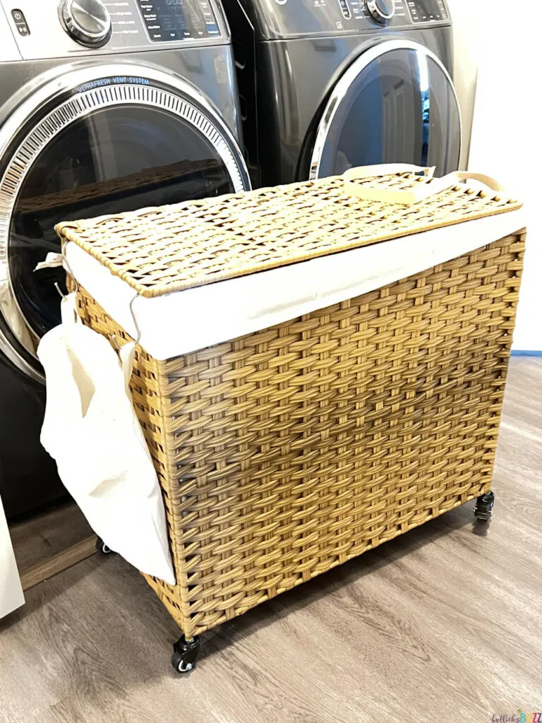 Songmics Home laundry hamper in front of a washer and dryer