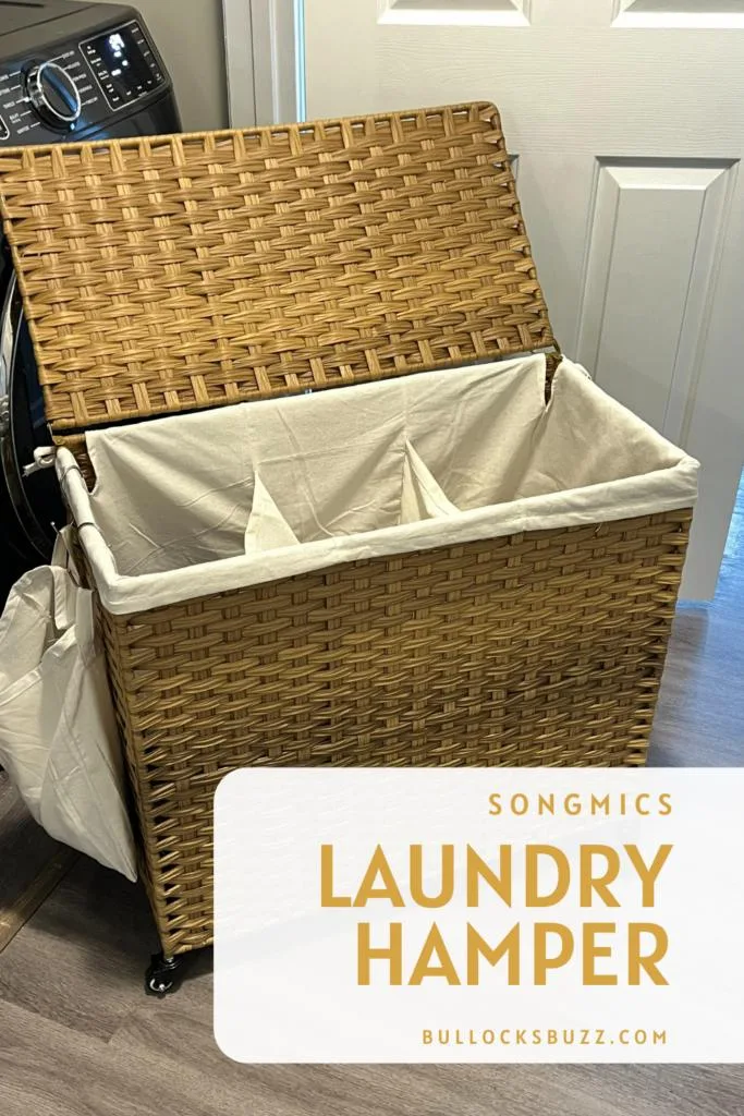 A rattan landry hamper with a lid and a cloth insert that divides the hamper into three sections.