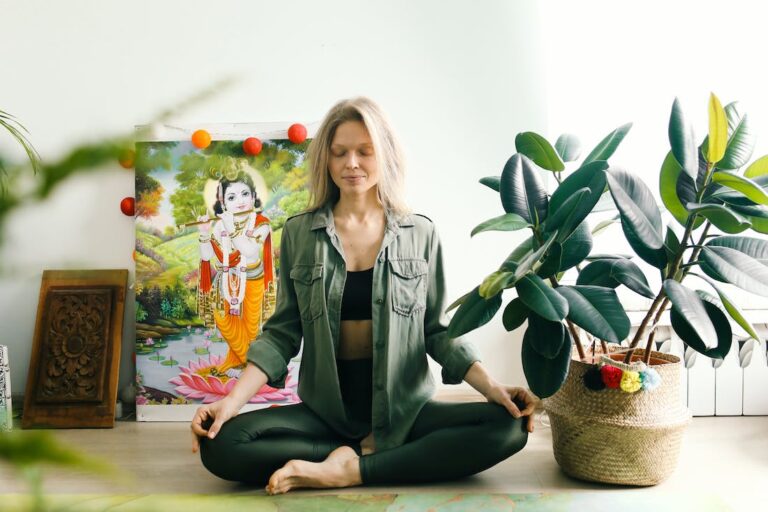 Woman meditating as part of focusing on wellness.