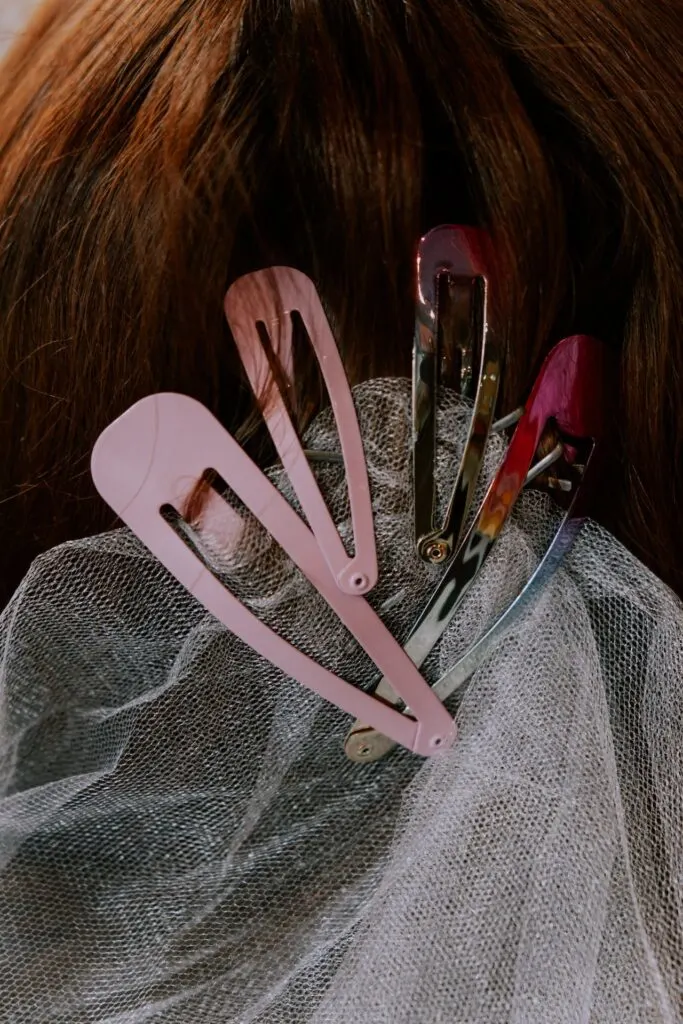 A selection of barattes in front of red hair.