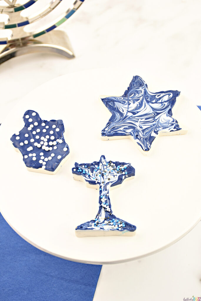 A close up image of three pieces of Homemade Hanukkah Candy finished and sitting on a white plate