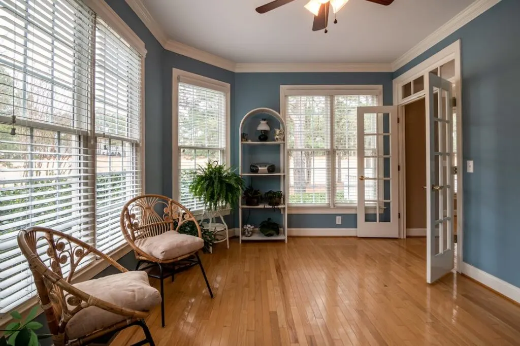 Using crown molding like in this sunroom is another of the best ways of enhancing the ceilings of your home.