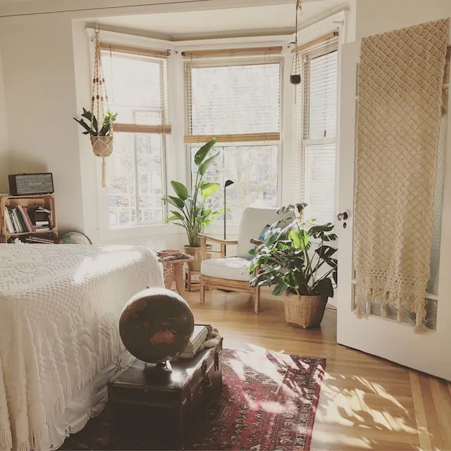 A beautifully decorated bedroom in neutral colors made by using tips for transforming your space.