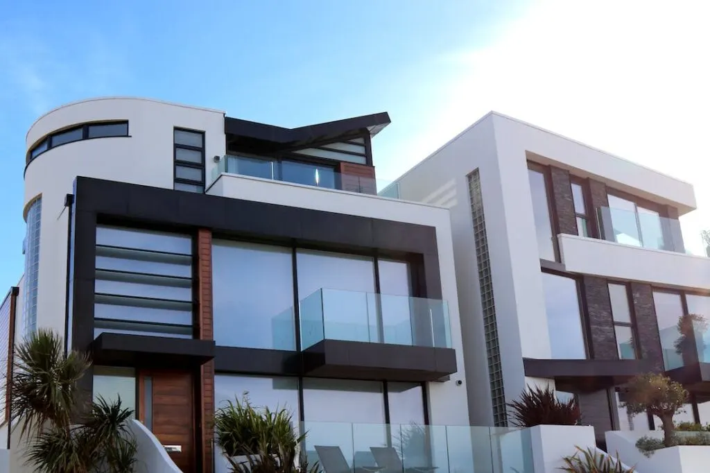 Getting to design buildings such as this beautiful glass and white stone building with lots of windows and a unique style is one of many reasons to choose architecture as a career choice