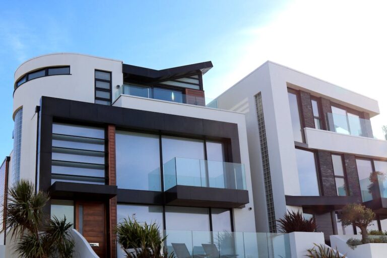 Getting to design buildings such as this beautiful glass and white stone building with lots of windows and a unique style is one of many reasons to choose architecture as a career