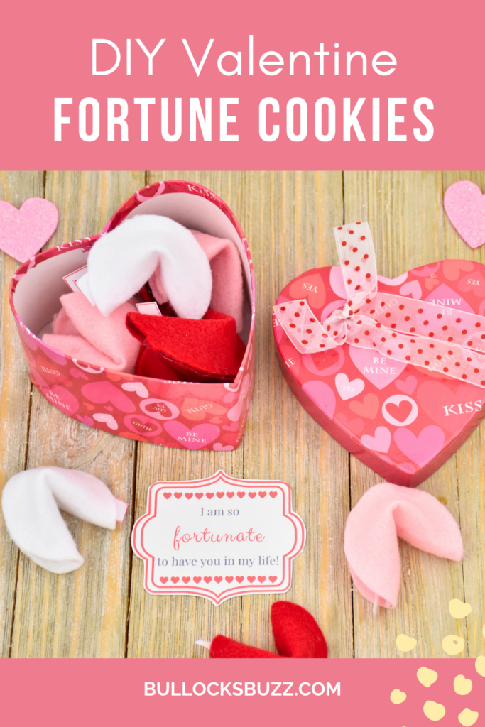 A heart shaped box full of felt fortune cookies sitting next to 3 DIY Felt Fortune Cookies for Valentine's Day in pink, red and white