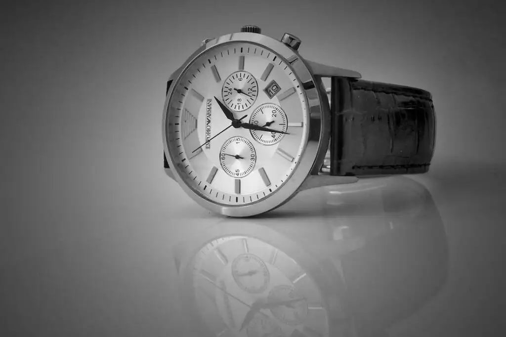 Watches, such as this one with a silver face and black band, are one of the most popular minimalist gift ideas