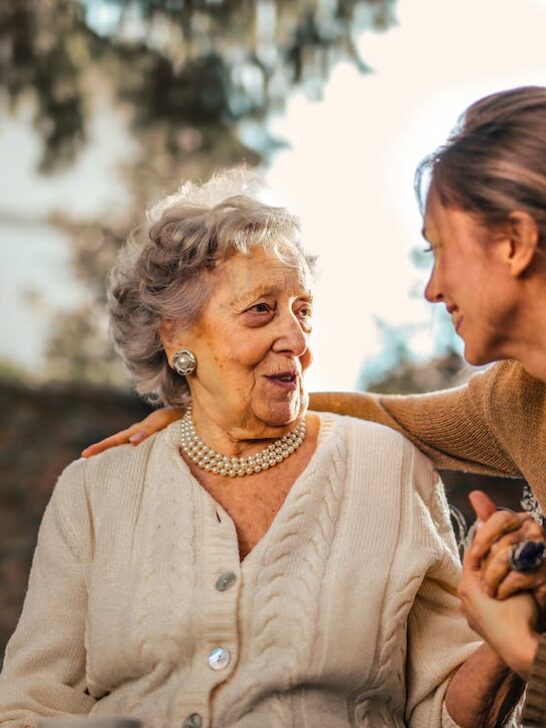 Woman talking with her elderly mom showing how communication is one of the key ways to ensure the well-being of elderly loved ones
