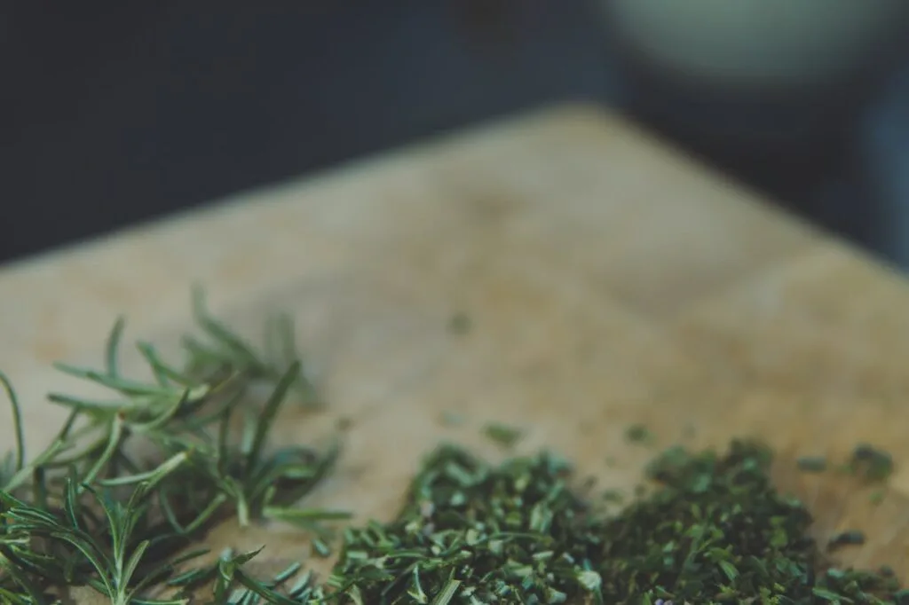 fresh herbs on a cutting board