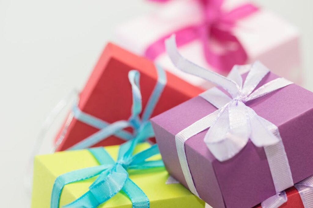 a pile of gifts for the modern professional wrapped in cheerful colors