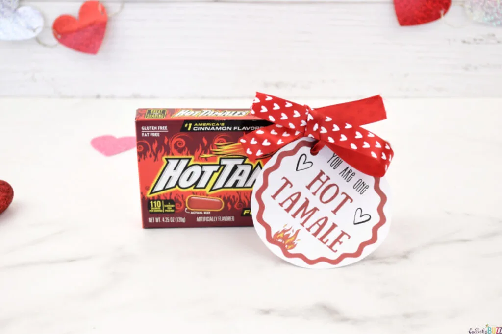 A box of Hot Tamale candies accompanied by a tag that says 'You Are One Hot Tamale' for the 14 Days of Valentines.