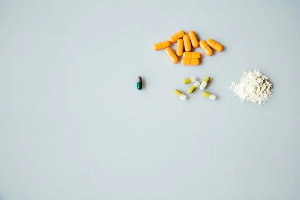 a variety of pills on a white background
