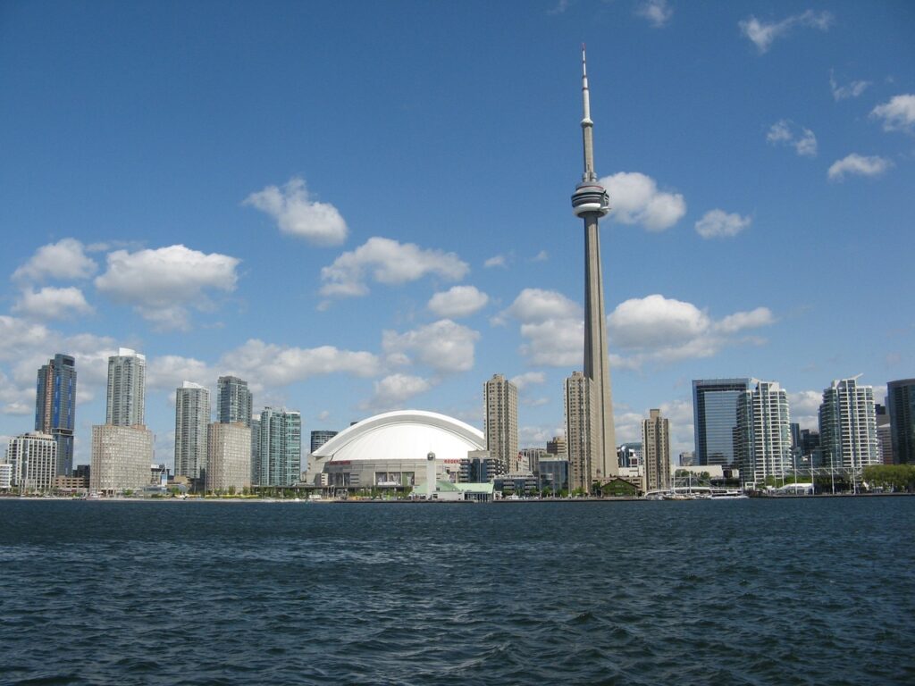 Looking back at the view of the CN Tower in Toronto from the water. Its one of the best places to visit in Canada.