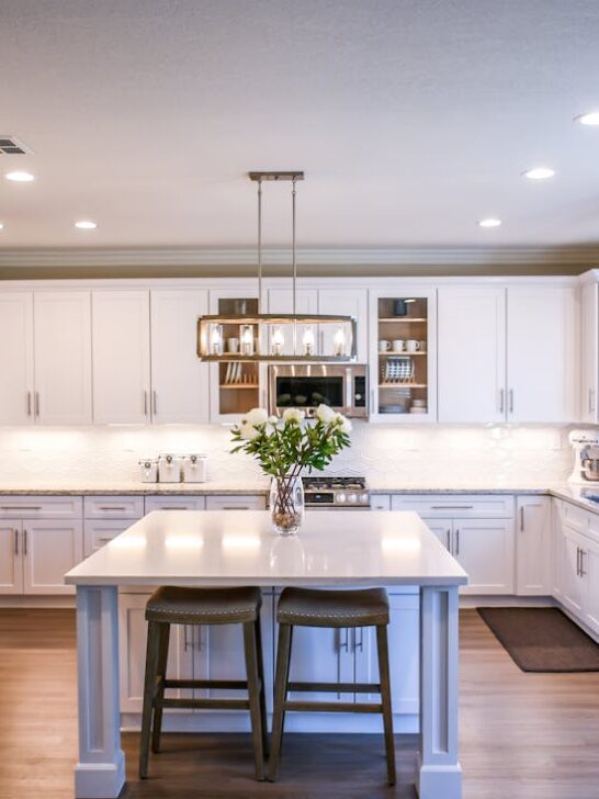 A beautiful white modern kitchen that uses the following tips to upgrade your kitchen.