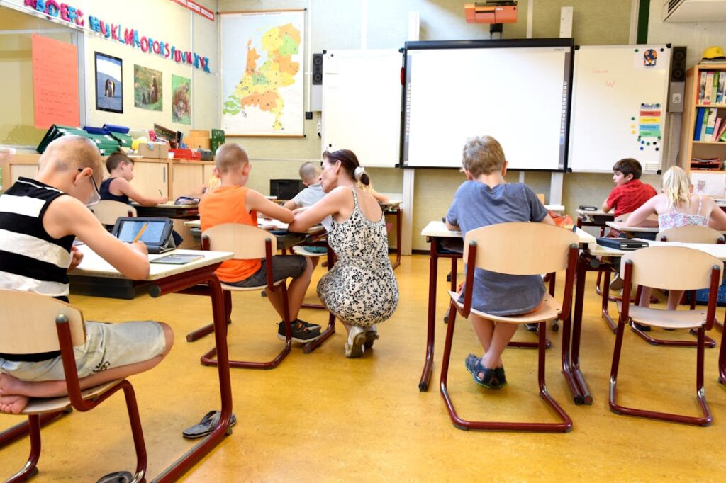 A small group of students working on an assignment at their desks during summer classes.