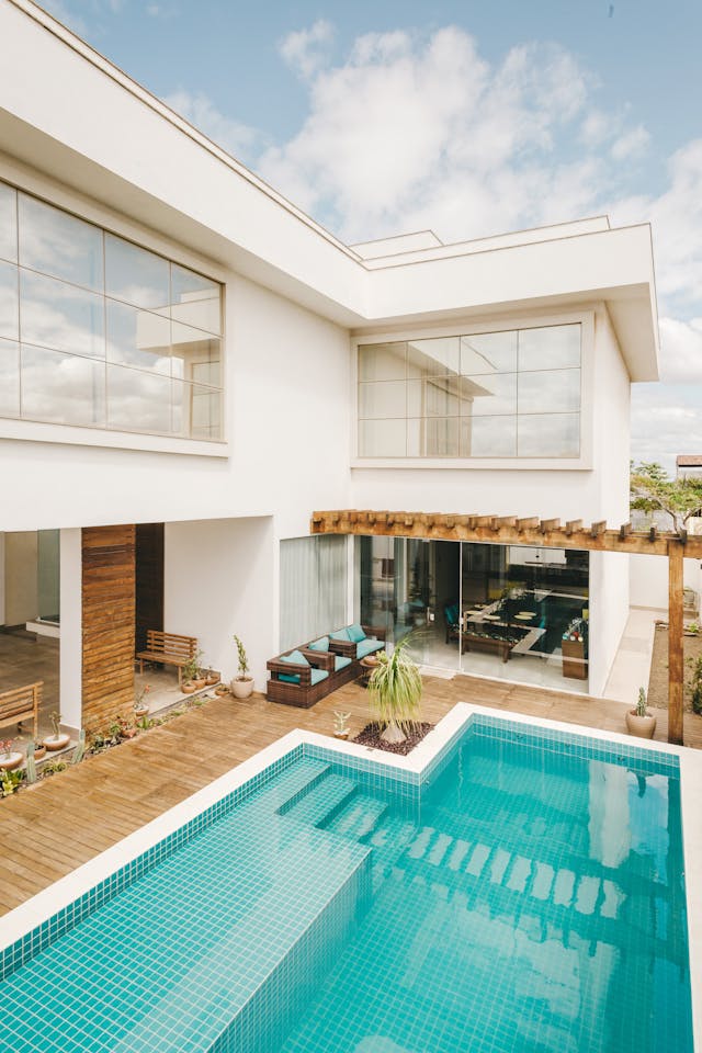 A gorgeous modern white home with a pool in back. Learn why now is the perfect time to buy your dream villa.