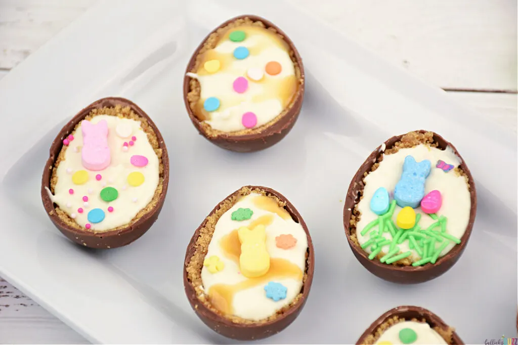 Close up image of four of the decorated cheesecake filled easter eggs