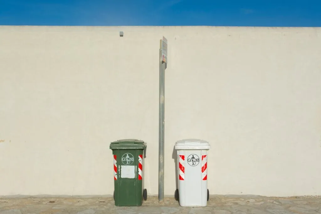 Two recycling bins offering an eco-friendly choice for when you are deciding how to dispose of old furniture