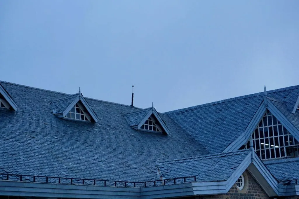 A roof on a home. Roof leaks can affect your health. Watch for these key signs.