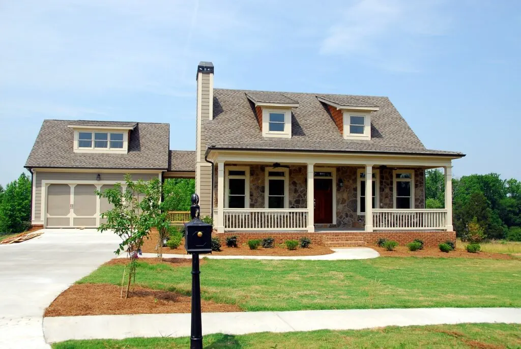 A cottage-style home with new landscaping. Search for creative landscaping ideas when designing your yard and garden for a gorgeous look!