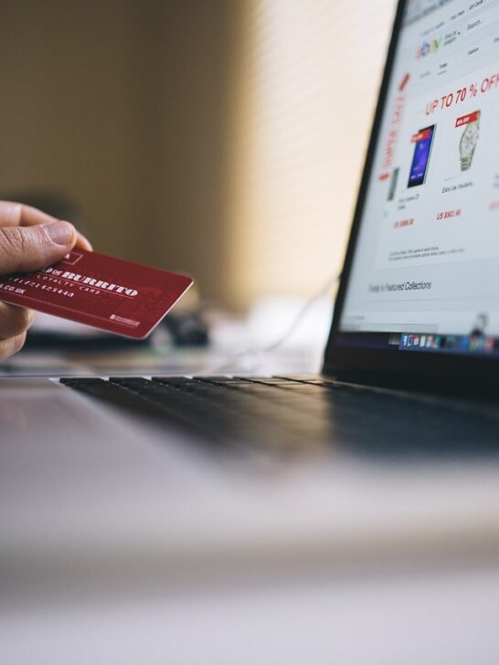Person buying online using credit card to gain credit card rewards