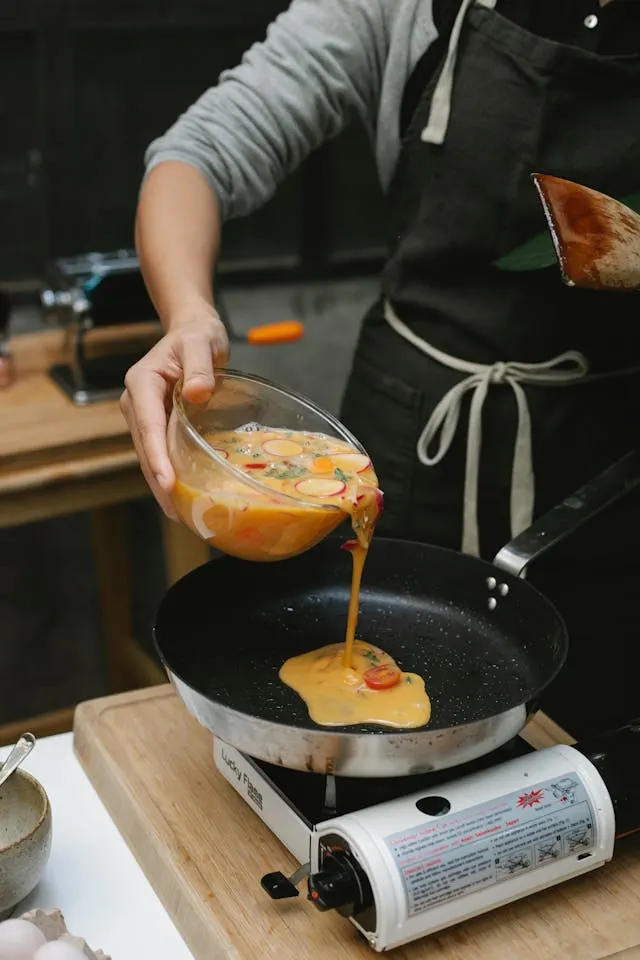 Man making a veggie omelette as one of several easy dinner ideas