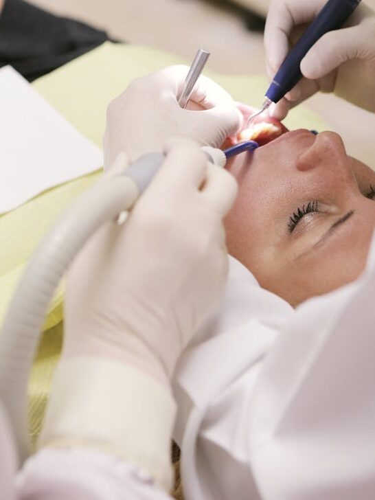 A person having her teeth worked on as an example of on of 4 expert dental tips including regular cleanings.