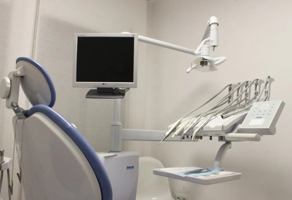A dental office chair and tools