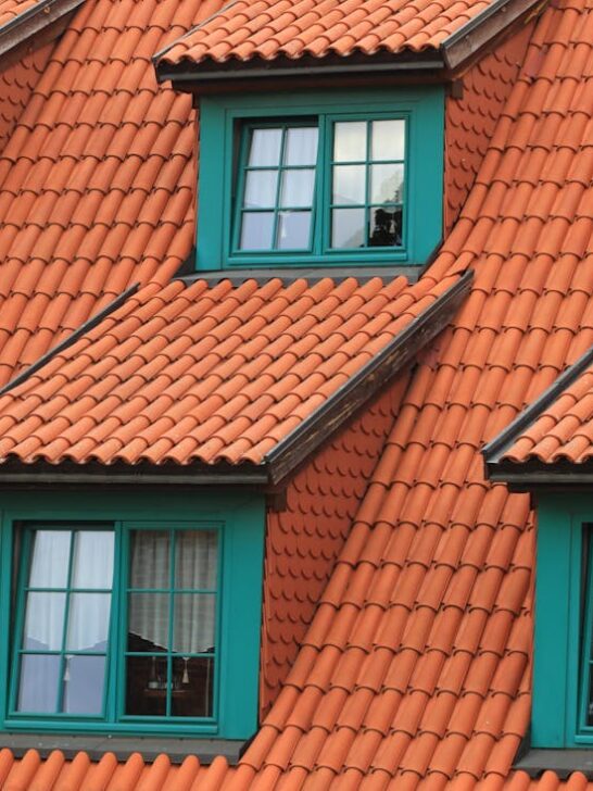 Orange shingles on a well-kept roof. Keep your roof in top shape with these essential roof maintenance tips for elderly homeowners.