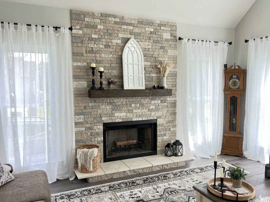 A remodeled fireplace with AirStone going from the hearth up to the ceiling