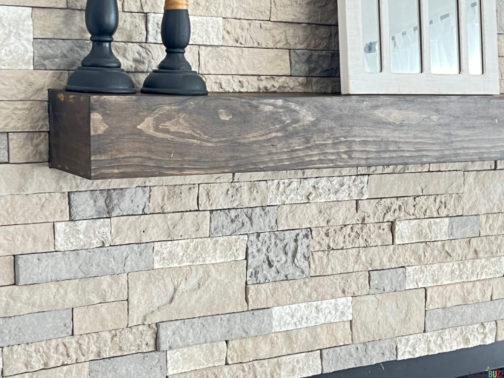 A closeup on the AirStone and mantel from our DIY Fireplace Remodel