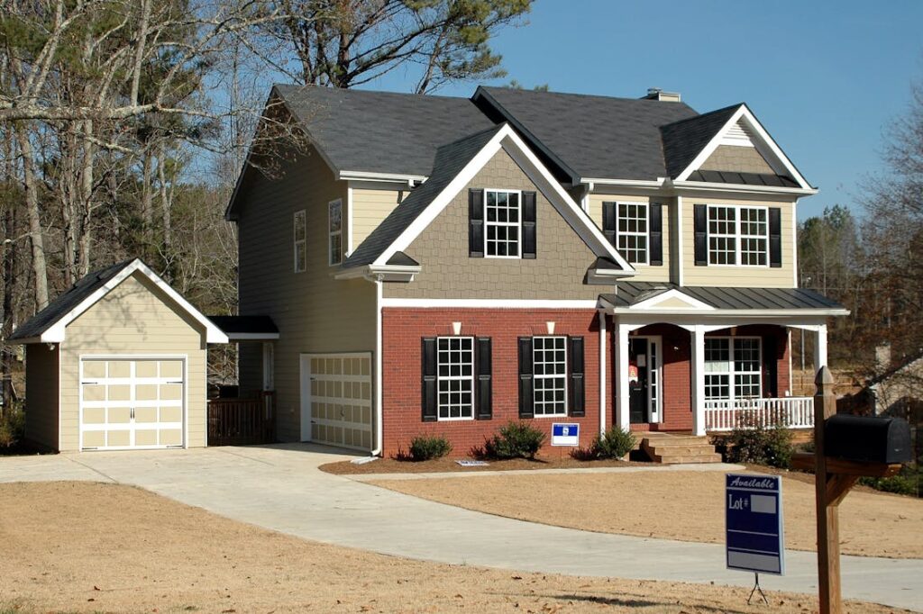 A brick home with a for sale sign in the yard whose owners are selling as is