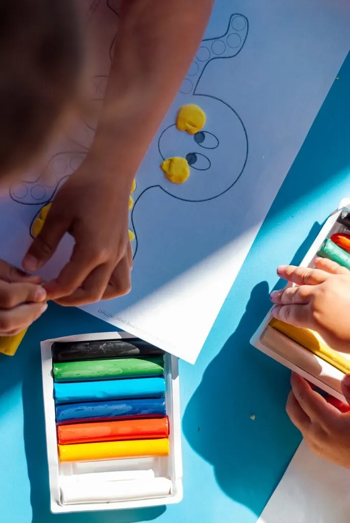 Children working on crafts and ways crafts can teach kids financial responsibility