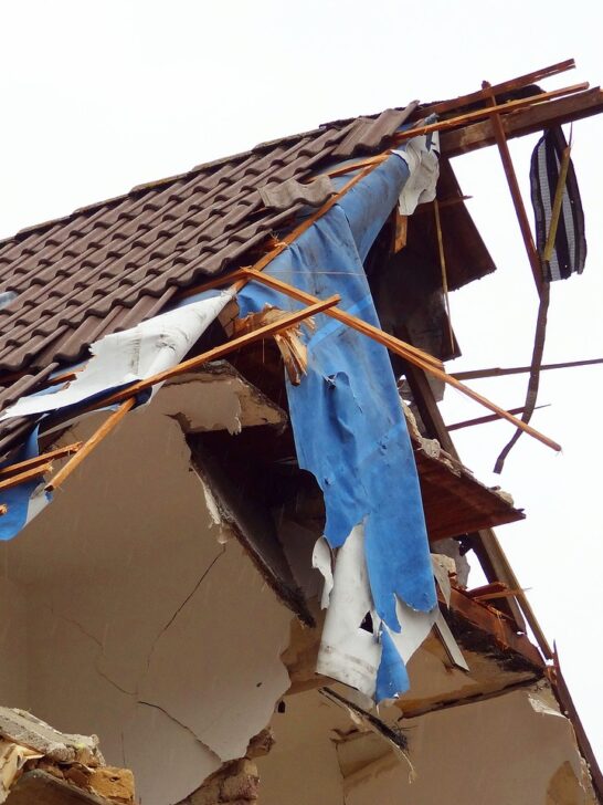 A house severely damaged requiring the owner to file insurance claims after home damage.