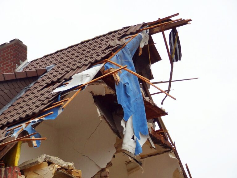 A house severely damaged requiring the owner to file insurance claims after home damage.