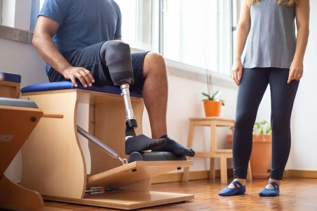 Man undergoing physical therapy as part of his post-injury health improvement plan