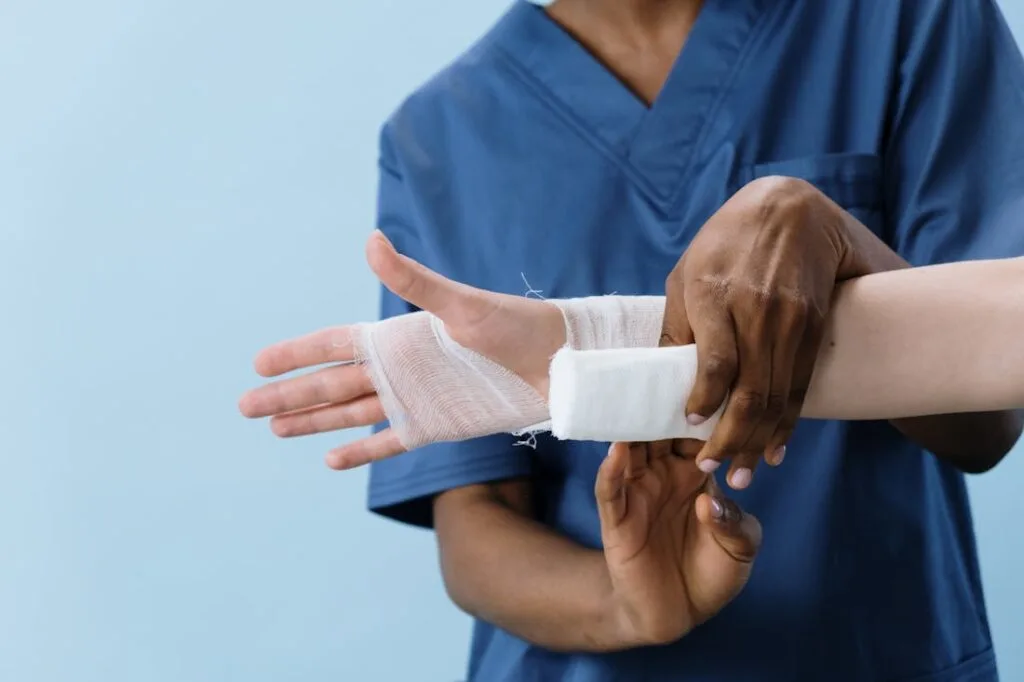 Person wrapping another person's wrist