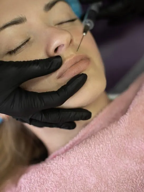 A woman getting Botox injections to cover fine lines