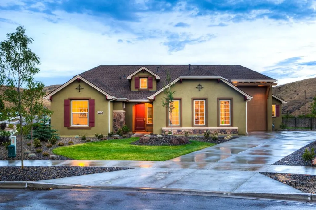 The outside of a house after a heavy rain. A leaky roof is one of the most common causes of hidden water damage,
